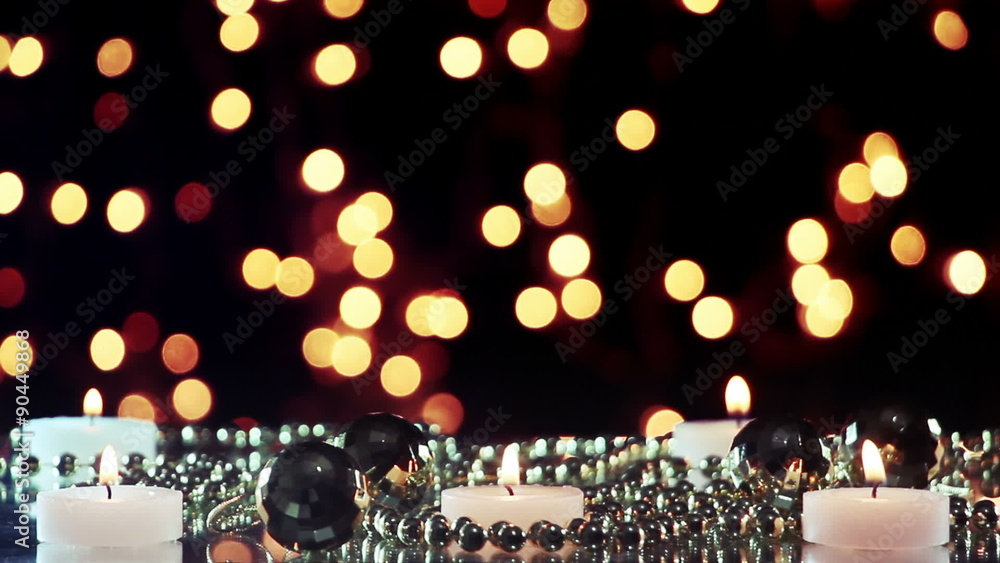 Poster burning candles and blinking bokeh lights loopable