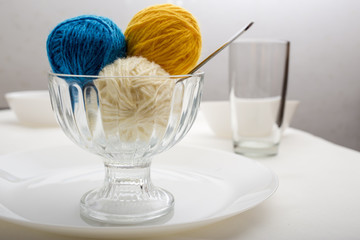 balls of wool yarn, which lie like ice cream dessert