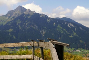 Fototapeta na wymiar Wooden fence in the Alps