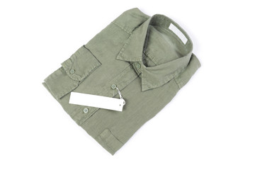 Top view,New trendy green linen shirt with label isolated on whi