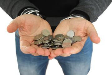 Large hands holding small coins