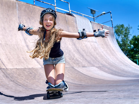 Teen girl rides his skateboard