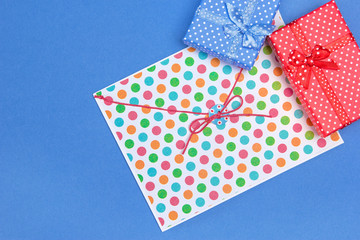 Blue and red gift boxes with envelope