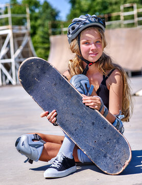 Teen girl rides his skateboard