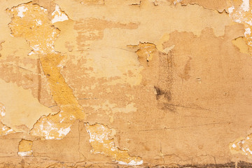 Old yellow plaster texture background