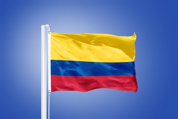 Flag of Colombia flying against a blue sky