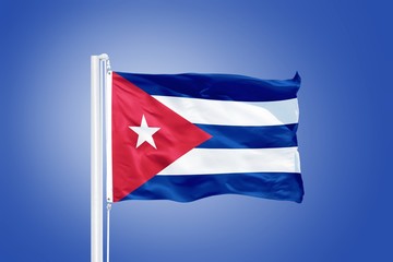 Flag of Cuba flying against a blue sky