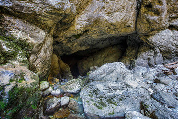 Entrance of a cave with underground river