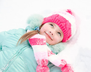 Portrait of smiling little girl in winter day