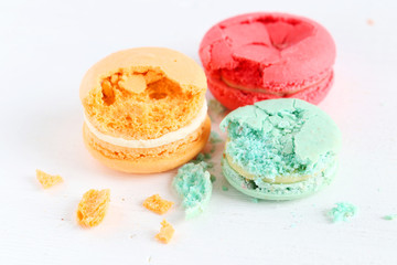 French colorful and tasty macarons on wooden table