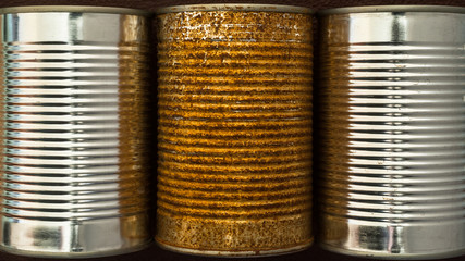 old rusty and clean new food container tin cans