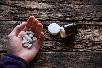 man wants to commit suicide by eating pills