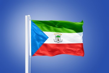 Flag of Equatorial Guinea flying against a blue sky