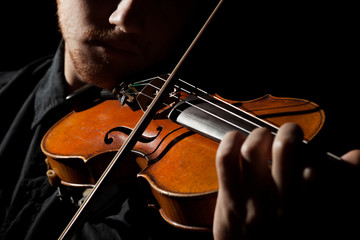 Close-up photo of man playing violin - Powered by Adobe