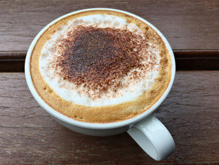 Coffee cup on wooden table.