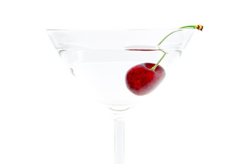 glass of drink with cherry closeup isolated on white background
