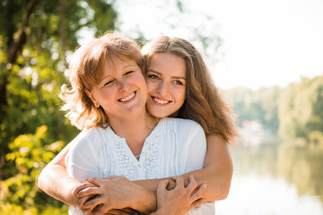 Happy together - mother and teenage daughter outdoor