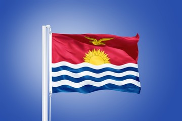 Flag of Kiribati flying against a blue sky