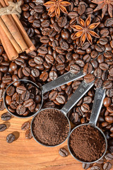 coffee beans and powder in the spoon, top view