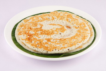 South Indian breakfast Dosa served on banana leaf.