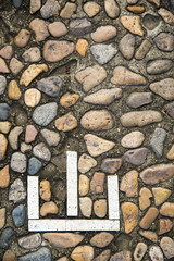 Gravel road with a signpost words