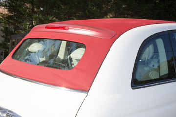 Top of red and white cabriolet