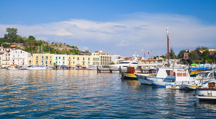 Fototapeta na wymiar Ischia port cityscape, harbor with fishing boats
