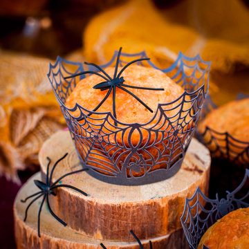 Halloween Pumpkin Muffins Decorated with Spiders and Spider Web