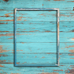 Old picture frame on vintage wood wall.