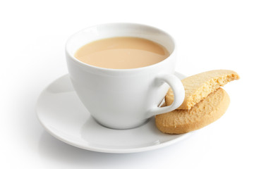 White ceramic cup and saucer with tea and shortbread biscuits. I