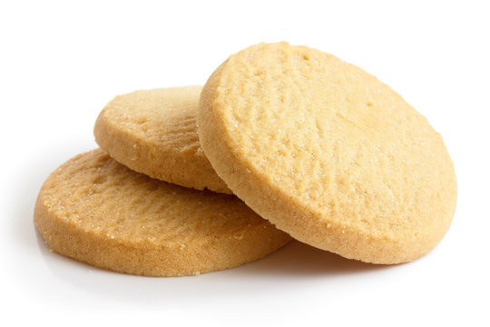 Three round shortbread biscuits isolated on white.