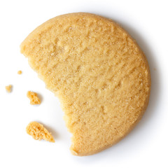 Single round shortbread biscuit with crumbs and bite missing. Fr