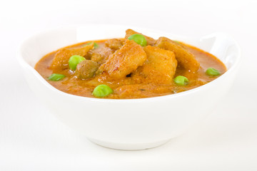 Aloo Matar - Potatoes and green peas cooked in a mild creamy tomato gravy.

