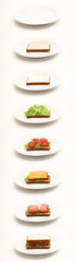Sandwich preparation on white plates