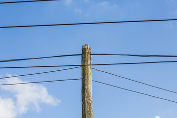 electric pole power lines and wires with blue sky