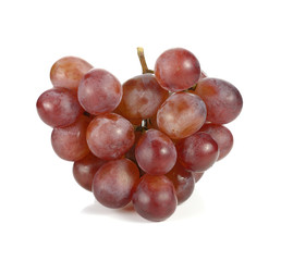 Bunch of red grapes isolated on white background.