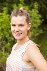 Naklejka premium Smiling blonde athlete looking at camera