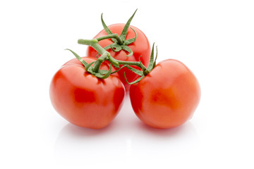 Tomato on the white isolatd background.