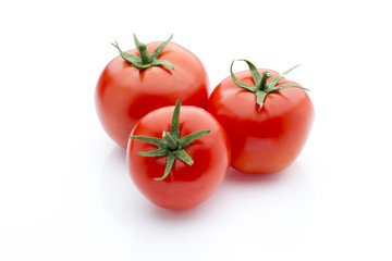 Tomato on the white isolatd background.