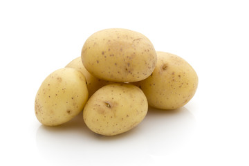 Potatoes on the white background.  New harvest.