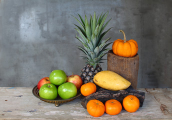 Still life apple, pineapple,pumpkin,tangerine, and mango fruits