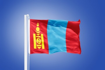 Flag of Mongolia flying against a blue sky