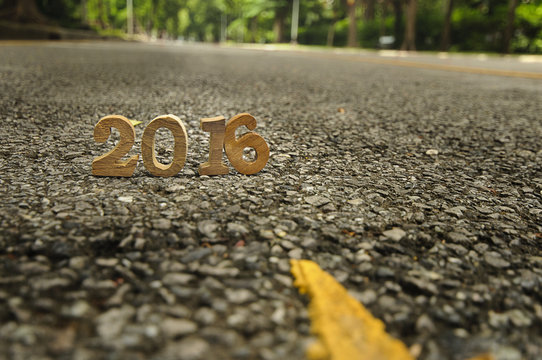 Head to New Year 2016 on road concept, wood number idea
