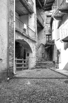 Vogogna (Ossola Valley, Piedmont): old alley. Black and white photo