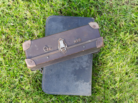 old suitcase on grass