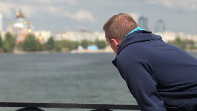 Man taking a breather while out for a run