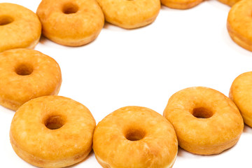 fried equal round doughnuts in frame