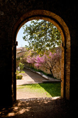 old stone arch and garden