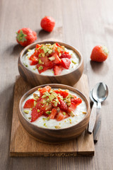 homemade yogurt with fresh strawberries and pistachios