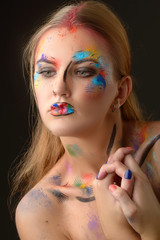 Beautiful woman with art make-up
